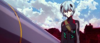 Movie still from “Evangelion: 3.0 You Can (Not) Redo” (2012), directed by Kiyotaka Suzuki – A woman standing in front of a sky with clouds; Close Up shot, Low angle
