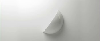 Movie still from “Everly” (2014), directed by Joe Lynch – A white wall with a curve on the wall; Extreme Close Up shot, Low angle