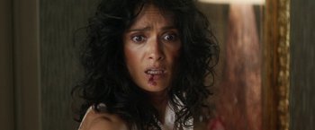 Movie still from “Everly” (2014), directed by Joe Lynch – A person with blood on their face; Close Up shot, Over the shoulder angle