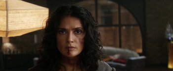 Movie still from “Everly” (2014), directed by Joe Lynch – A person with blood on her face; Close Up shot, Low angle