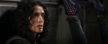 Movie still from “Everly” (2014), directed by Joe Lynch – A person with blood on their face; Close Up shot, Low angle