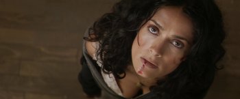 Movie still from “Everly” (2014), directed by Joe Lynch – A person with blood on her face; Close Up shot, Overhead angle