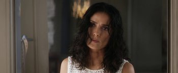 Movie still from “Everly” (2014), directed by Joe Lynch – A person wearing a white shirt; Close Up shot, Over the shoulder angle