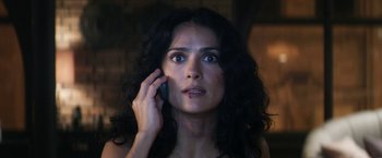 Movie still from “Everly” (2014), directed by Joe Lynch – A woman is talking on a cell phone; Close Up shot, Low angle