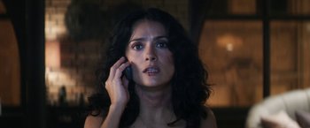 Movie still from “Everly” (2014), directed by Joe Lynch – A woman is talking on a cell phone; Close Up shot, Low angle