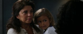 Movie still from “Everly” (2014), directed by Joe Lynch – A woman and a young girl posing for a picture; Close Up shot, High angle