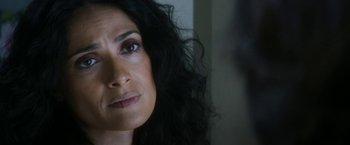 Movie still from “Everly” (2014), directed by Joe Lynch – A woman's face with long black hair; Close Up shot, Over the shoulder angle