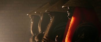 Movie still from “Everly” (2014), directed by Joe Lynch – A group of people with hats on their heads; Close Up shot, Low angle