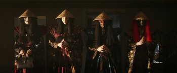 Movie still from “Everly” (2014), directed by Joe Lynch – A couple of people that are standing up; Medium shot, Low angle