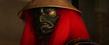 Movie still from “Everly” (2014), directed by Joe Lynch – A person wearing a mask and a hat; Close Up shot, Low angle