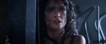 Movie still from “Everly” (2014), directed by Joe Lynch – A person with blood on their face; Close Up shot, Low angle