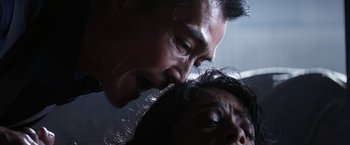 Movie still from “Everly” (2014), directed by Joe Lynch – A man and a woman kissing; Extreme Close Up shot, Low angle