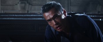 Movie still from “Everly” (2014), directed by Joe Lynch – A person with a knife in his mouth; Close Up shot, Low angle