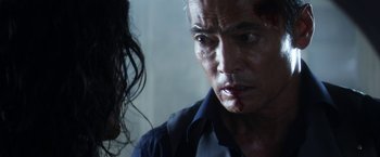 Movie still from “Everly” (2014), directed by Joe Lynch – A person with blood on their face; Close Up shot, Over the shoulder angle