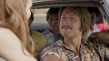 Movie still from “Everybody Wants Some!!” (2016), directed by Richard Linklater – A man with a mustache sitting in the back of a car; Close Up shot, Over the shoulder angle