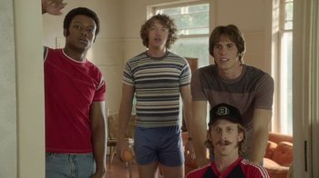 Movie still from “Everybody Wants Some!!” (2016), directed by Richard Linklater – A group of young men standing next to each other in a room; Medium shot, Low angle