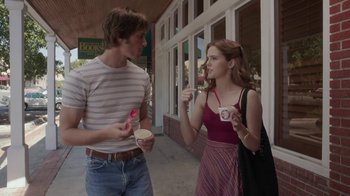 Movie still from “Everybody Wants Some!!” (2016), directed by Richard Linklater – A man and a woman eating ice - cream outside; Medium shot, Over the shoulder angle