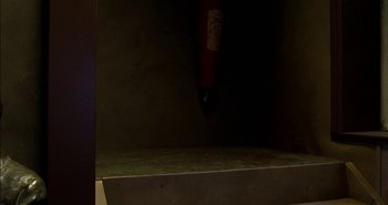 Movie still from “Evil” (2003), directed by Mikael Håfström – An object that is in the air with a red tube; Wide shot, Low angle