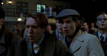 Movie still from “Evil” (2003), directed by Mikael Håfström – A group of young men standing next to each other; Close Up shot, Low angle