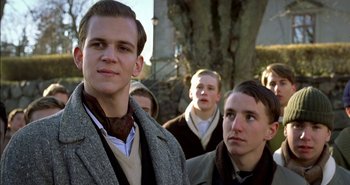 Movie still from “Evil” (2003), directed by Mikael Håfström – A group of young men standing next to each other; Close Up shot, Low angle