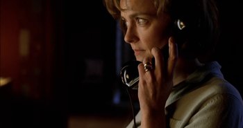 Movie still from “Evil” (2003), directed by Mikael Håfström – A person with a phone in their hand; Close Up shot, Low angle