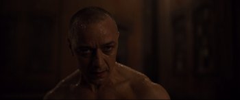 Movie still from “Glass” (2019), directed by M. Night Shyamalan – A person in a shower; Close Up shot, Low angle