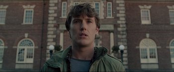 Movie still from “Glass” (2019), directed by M. Night Shyamalan – A person wearing a jacket; Close Up shot, Low angle