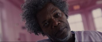 Movie still from “Glass” (2019), directed by M. Night Shyamalan – A person with a beard; Close Up shot, Low angle