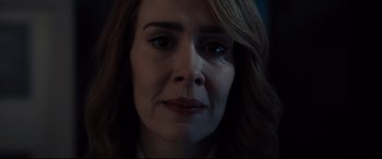 Movie still from “Glass” (2019), directed by M. Night Shyamalan – A woman's face in the dark; Close Up shot, Over the shoulder angle