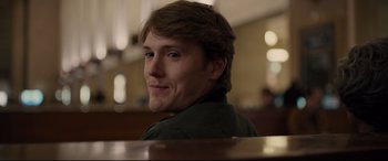 Movie still from “Glass” (2019), directed by M. Night Shyamalan – A man sitting at a table in front of a window; Close Up shot, Over the shoulder angle