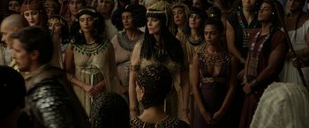 Movie still from “Exodus: Gods and Kings” (2014), directed by Ridley Scott – A group of women in costume standing in a crowd; Medium shot, High angle