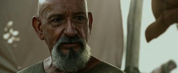Movie still from “Exodus: Gods and Kings” (2014), directed by Ridley Scott – An older man with a beard and a mustache; Close Up shot, Over the shoulder angle
