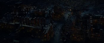 Movie still from “Exodus: Gods and Kings” (2014), directed by Ridley Scott – An aerial view of a city at night with lights on; Extreme Wide shot, High angle