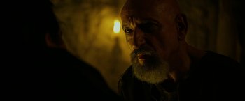 Movie still from “Exodus: Gods and Kings” (2014), directed by Ridley Scott – An old man with a beard is looking at the camera; Close Up shot, Over the shoulder angle