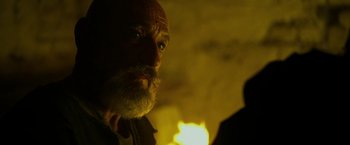 Movie still from “Exodus: Gods and Kings” (2014), directed by Ridley Scott – An old man with a beard is looking at the camera; Close Up shot, Low angle