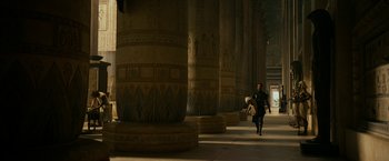 Movie still from “Exodus: Gods and Kings” (2014), directed by Ridley Scott – A person walking in front of pillars in a building; Extreme Wide shot, Low angle