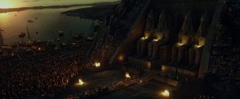 Movie still from “Exodus: Gods and Kings” (2014), directed by Ridley Scott – A crowd of people standing in front of a building; Extreme Wide shot, High angle