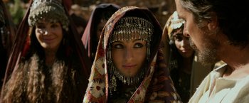 Movie still from “Exodus: Gods and Kings” (2014), directed by Ridley Scott – A woman in a headdress and a scarf; Close Up shot, Over the shoulder angle
