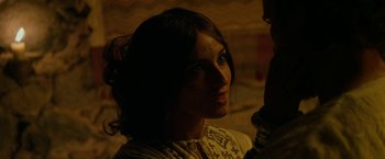 Movie still from “Exodus: Gods and Kings” (2014), directed by Ridley Scott – A woman is looking into the distance in the dark; Close Up shot, Over the shoulder angle