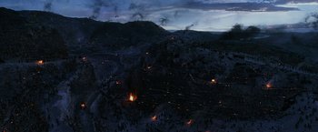 Movie still from “Exodus: Gods and Kings” (2014), directed by Ridley Scott – An aerial view of a mountain with a lot of fires in it; Extreme Wide shot, High angle