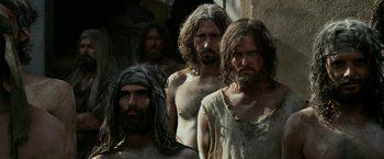 Movie still from “Exodus: Gods and Kings” (2014), directed by Ridley Scott – A group of men standing next to each other; Medium shot, Low angle