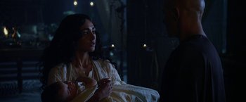 Movie still from “Exodus: Gods and Kings” (2014), directed by Ridley Scott – A man and a woman sitting in a dark room; Close Up shot, Over the shoulder angle