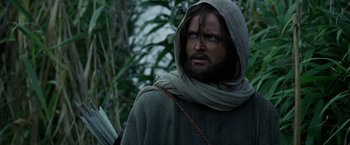 Movie still from “Exodus: Gods and Kings” (2014), directed by Ridley Scott – A man with a beard wearing a hood and glasses; Medium shot, Over the shoulder angle