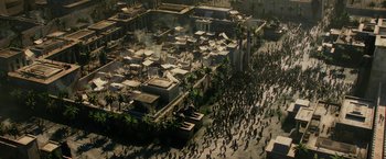 Movie still from “Exodus: Gods and Kings” (2014), directed by Ridley Scott – An aerial view of a city with a lot of people walking on it; Extreme Wide shot, High angle