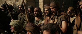 Movie still from “Exodus: Gods and Kings” (2014), directed by Ridley Scott – A group of men dressed in biblical clothing; Medium shot, Over the shoulder angle