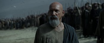 Movie still from “Exodus: Gods and Kings” (2014), directed by Ridley Scott – An old man with a long beard is standing in front of a group of people; Close Up shot, Low angle