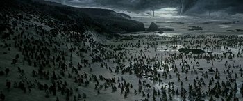 Movie still from “Exodus: Gods and Kings” (2014), directed by Ridley Scott – A large group of people on the beach; Extreme Wide shot, High angle