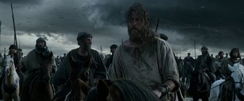 Movie still from “Exodus: Gods and Kings” (2014), directed by Ridley Scott – A group of men standing next to each other on horses; Medium shot, Low angle