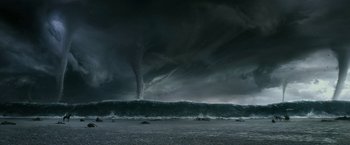 Movie still from “Exodus: Gods and Kings” (2014), directed by Ridley Scott – A large wave crashing on to the shore of a beach; Extreme Wide shot, Low angle