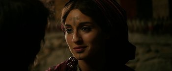Movie still from “Exodus: Gods and Kings” (2014), directed by Ridley Scott – A beautiful woman with long brown hair wearing a headdress; Close Up shot, Over the shoulder angle
